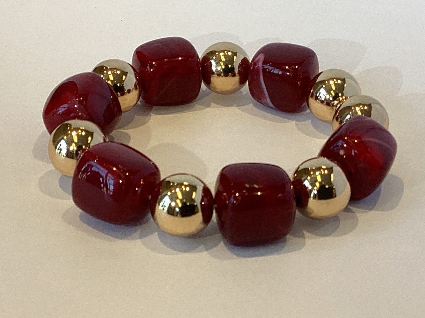 Acrylic Beaded Bracelet in Deep Red Marble Design with Gold Accents
