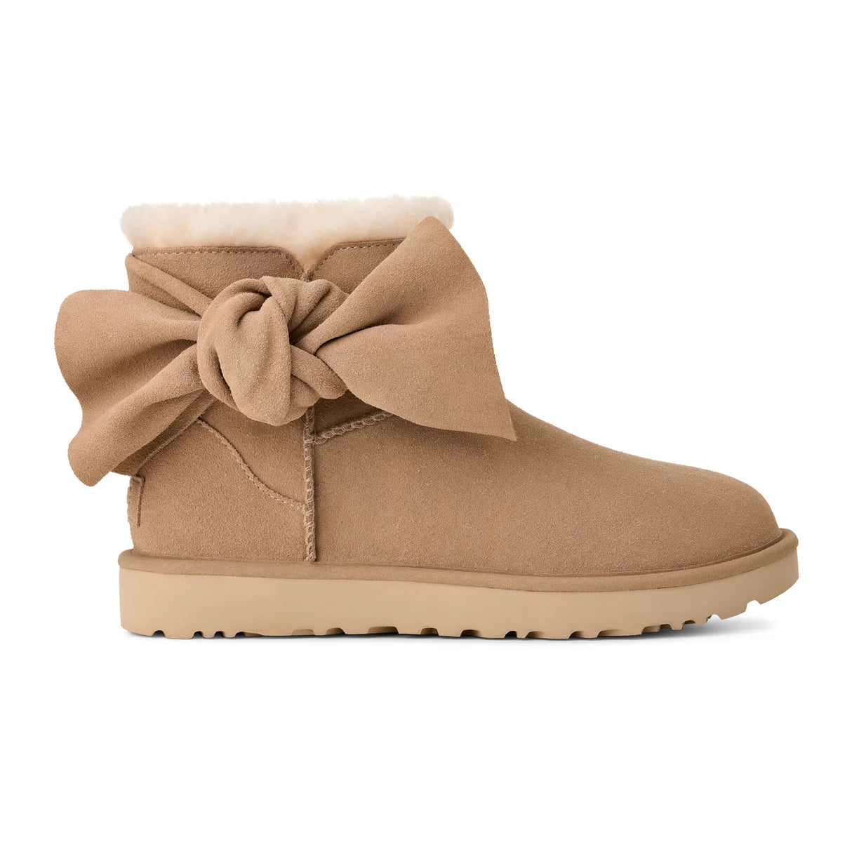 UGG® Classic Mini Bow (Women) - Sand