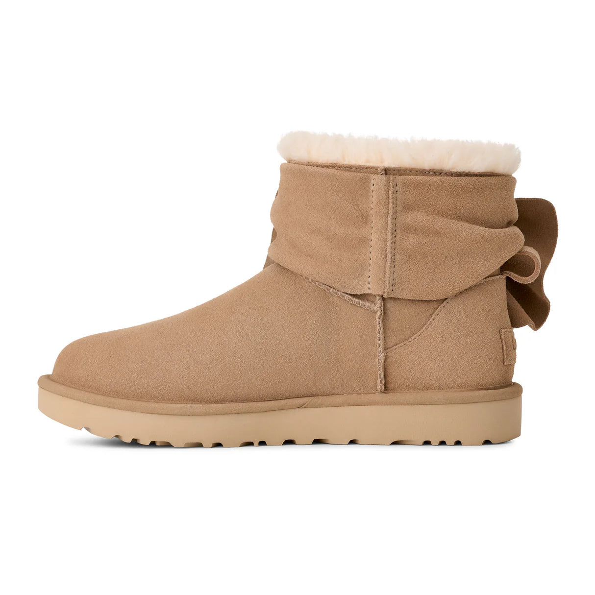 UGG® Classic Mini Bow (Women) - Sand