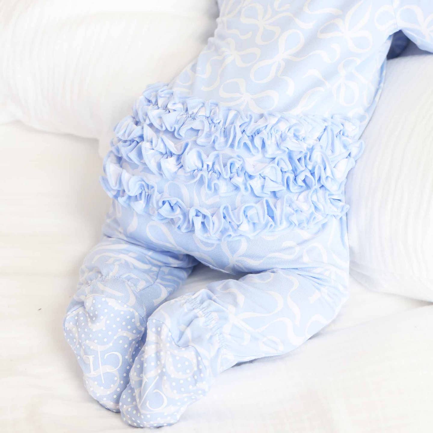 Blue-Tiful Bows Ruffle Zip Footie